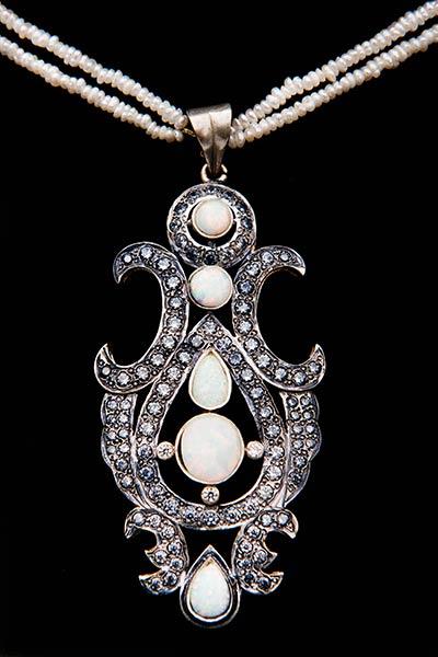 22 Karat Gold White Opal Style Necklace With Grey Zircons And White Strings.